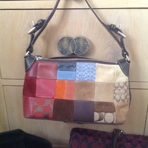Multi color leather shoulder bag by Coach.